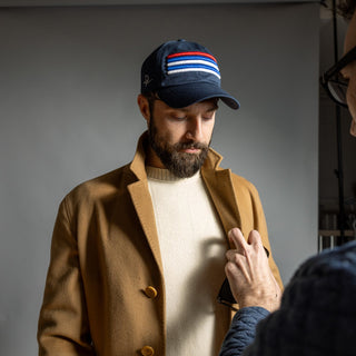 Dark Yarn Nautilus Reserve Dockside Cap, stylish headwear with a nautical design, featuring adjustable strap and embroidered logo detail.
