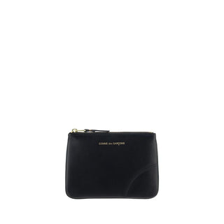 Black Calf Leather Bos Taurus Wallet by Comme Des Garçons showing front view with embossed logo and sleek design.