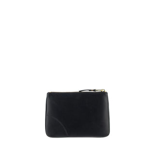 Black calf leather Bos Taurus wallet by Comme Des Garçons with multiple card slots and sleek design.