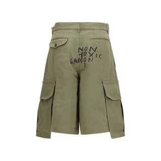 Bicolor cotton Bermuda shorts by Comme Des Garçons featuring a relaxed fit and stylish two-tone design.