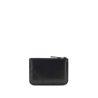 Black calf leather Bos Taurus wallet by Comme Des Garçons, featuring a sleek, minimalist design with card slots and branding details.