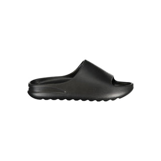 Black polyurethane men's slipper from Norway 1963, featuring a comfortable slip-on design and cushioned interior.