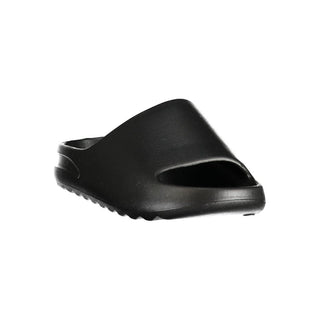 Black polyurethane men's slipper by Norway 1963, showing cushioned sole and slip-on design for comfortable indoor wear.