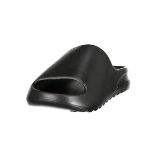 Black polyurethane men's slipper from Norway 1963 with a comfortable slip-on design and textured sole for indoor wear.
