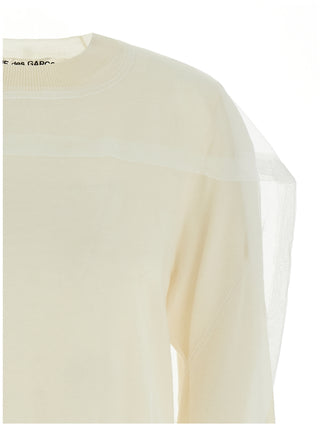 White wool cardigan by Comme Des Garçons, featuring a cozy knit design and classic button closure.