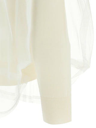 White wool cardigan by Comme Des Garçons, featuring a cozy knit design and button-up front, displayed on a hanger.