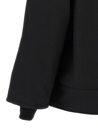 Black polyester full-length jacket by Comme Des Garçons, stylish outerwear with a sleek, modern design.