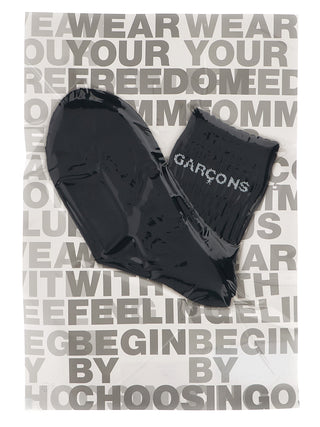Bicolor cotton socks by Comme Des Garçons featuring contrasting color blocks and a comfortable fit.
