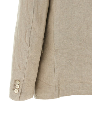 Beige linen blazer by Comme Des Garçons, tailored fit with classic lapels, displayed on a hanger.