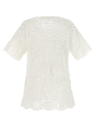 White cotton T-shirt by Comme Des Garçons, showcasing a classic fit and soft fabric, displayed on a plain background.