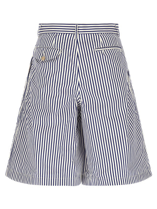 Blue cotton Bermuda shorts by Comme Des Garçons, shown with a relaxed fit and clean design, ideal for casual summer wear.