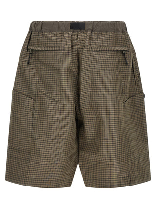 Comme Des Garçons bicolor linen Bermuda shorts featuring a relaxed fit and stylish design, perfect for casual summer wear.
