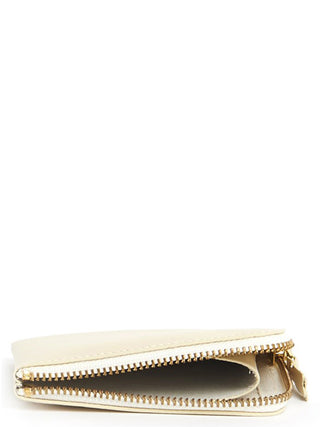 Beige cowhide cardholder from Comme Des Garçons with multiple card slots and a sleek, minimalist design.