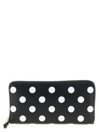 Bicolor calfskin wallet by Comme Des Garçons featuring a sleek, compact design with contrasting colors and textured leather.