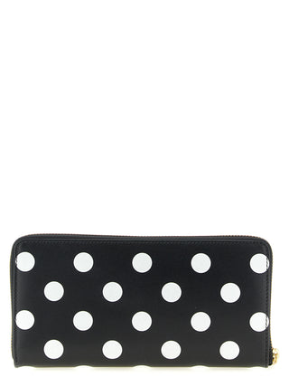 Bicolor calfskin wallet by Comme Des Garçons featuring a sleek design and compact size for everyday use.