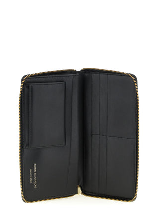 Bicolor calfskin wallet by Comme Des Garçons featuring a sleek, stylish design with multiple card slots and a smooth leather finish.