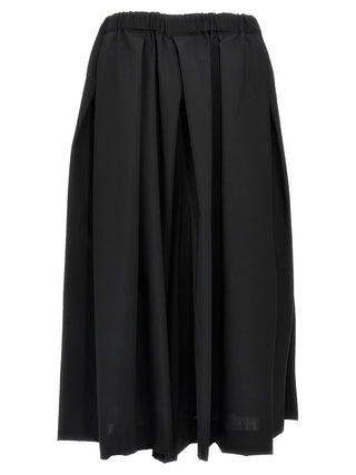 Black wool midi skirt by Comme Des Garçons, featuring a stylish, flowy design and a mid-length silhouette on a plain background.