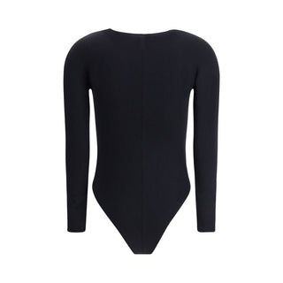 Black Wolford polyamide bodysuit with long sleeves and seamless design, shown on a mannequin.