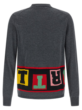 Gray acetate cardigan by Comme Des Garçons, showcasing a relaxed fit with textured fabric and button closure.