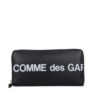 Black leather wallet by Comme Des Garçons with multiple card slots and a sleek minimalist design.