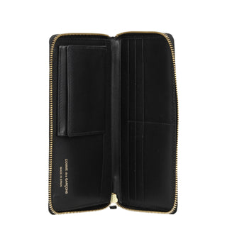 Black leather wallet by Comme Des Garçons with multiple card slots and minimalist design.