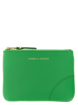 Bicolor leather cardholder by Comme Des Garçons with multiple card slots and sleek minimalist design.