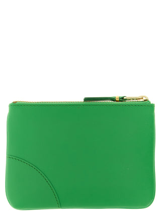 Bicolor leather cardholder by Comme Des Garçons with multiple card slots and sleek design, shown in the image.
