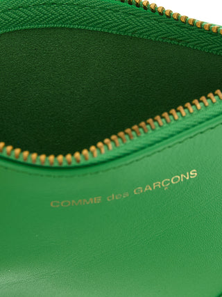 Bicolor leather cardholder by Comme Des Garçons with multiple card slots and sleek design.
