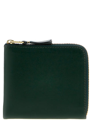 Bicolor calfskin cardholder by Comme Des Garçons with multiple card slots and sleek design.