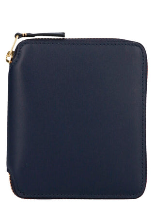 Blue calfskin wallet by Comme Des Garçons with multiple card slots and sleek design, showcasing fine craftsmanship and smooth leather.