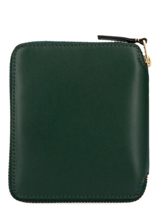 Bicolor calfskin wallet by Comme Des Garçons with sleek design and multiple card slots, showcasing high-quality craftsmanship.