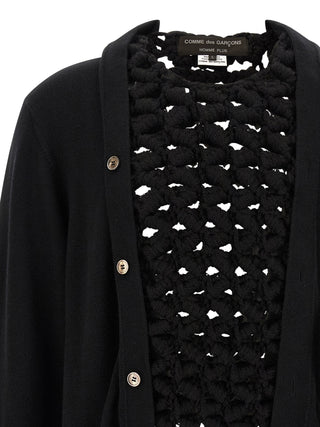 Black wool cardigan by Comme Des Garçons, featuring a cozy knit texture and classic design, displayed on a plain background.