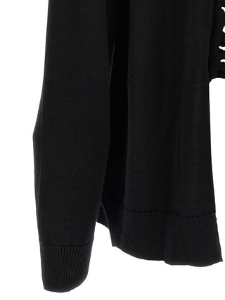 Black wool cardigan by Comme Des Garçons, featuring a cozy knit fabric and classic design, displayed on a neutral background.