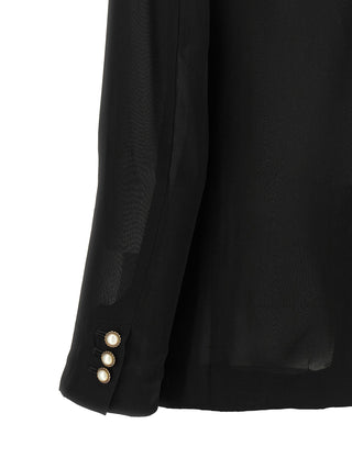 Black polyester blazer by Comme Des Garçons, tailored fit with classic lapels and structured design, displayed on a hanger.