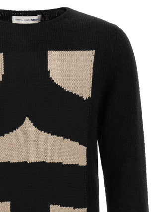 Black polyester cardigan by Comme Des Garçons, featuring a stylish, slim-fit design with a button-up front and long sleeves.