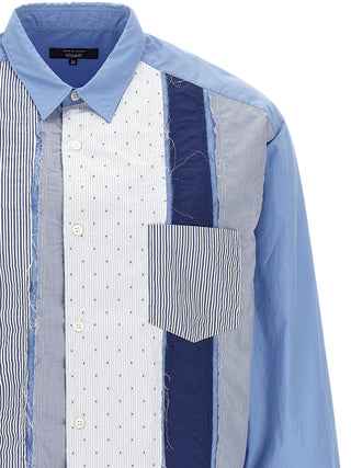 Blue cotton blouse by Comme Des Garçons, featuring a relaxed fit and stylish design on a mannequin.
