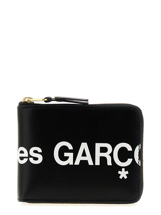 Bicolor calfskin cardholder by Comme Des Garçons with sleek design and multiple card slots visible in the image.