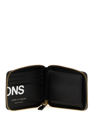 Bicolor calfskin cardholder by Comme Des Garçons featuring sleek design and multiple card slots.
