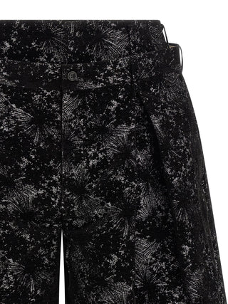 Black polyester Bermuda shorts by Comme Des Garçons, featuring a relaxed fit and clean design, suitable for casual wear.