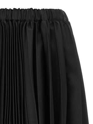Black polyester long skirt by Comme Des Garçons, featuring a sleek, flowing design with a high waist and minimalist style.