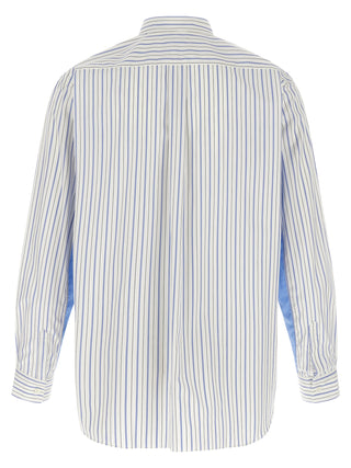 Multicolor cotton blouse by Comme Des Garçons, featuring vibrant fabric and stylish design, displayed on a hanger.