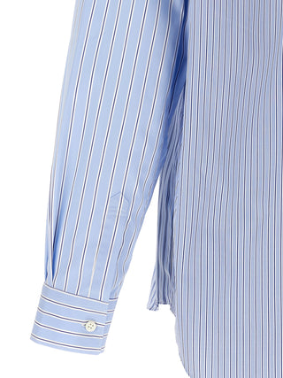 Blue cotton blouse by Comme Des Garçons, shown in a relaxed fit with long sleeves and a classic collar.