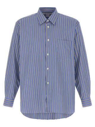 Blue cotton blouse by Comme Des Garçons with a relaxed fit and classic collar, displayed on a hanger.