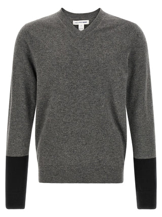 Gray wool cardigan by Comme Des Garçons featuring a soft knit texture and classic button-up front.