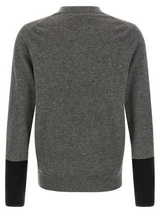 Gray wool cardigan by Comme Des Garçons, featuring a cozy knit texture and classic button-front design.