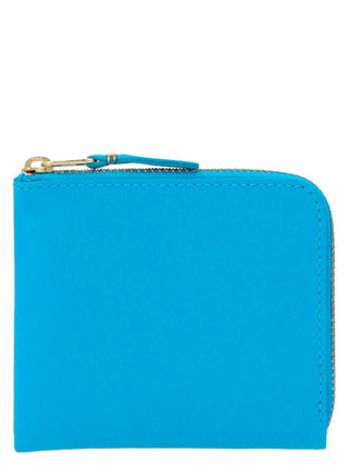 Blue calfskin cardholder from Comme Des Garçons with multiple card slots and sleek minimalist design.