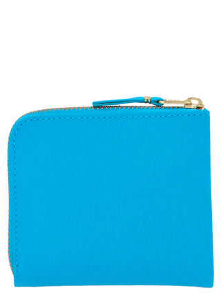 Blue calfskin cardholder by Comme Des Garçons with multiple card slots and sleek design.