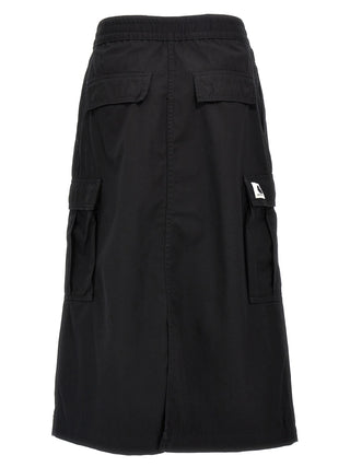 Black cotton midi skirt by Carhartt Wip, featuring a high waist and relaxed fit, shown on a model.