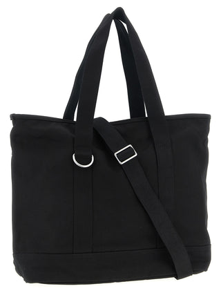 Black Carhartt Wip cotton tote bag with sturdy handles and minimalist design, perfect for carrying everyday essentials.