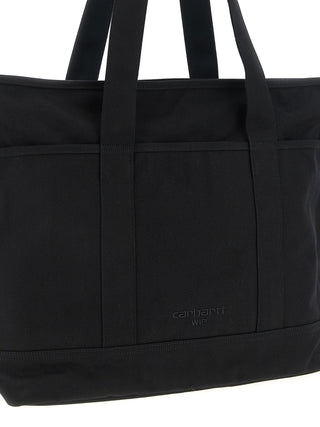 Black Carhartt Wip cotton tote bag with sturdy handles and minimalist design, perfect for casual carrying and everyday use.